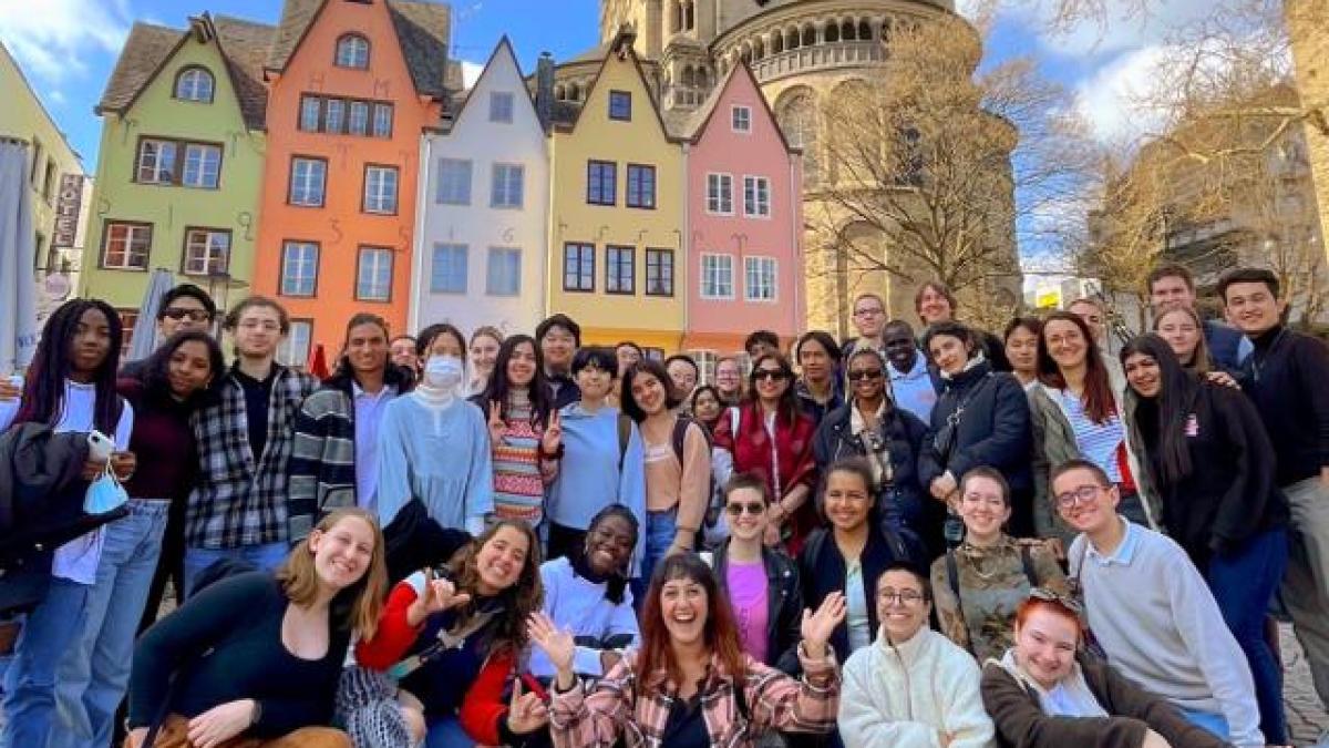 a group of people standing in front of a building
