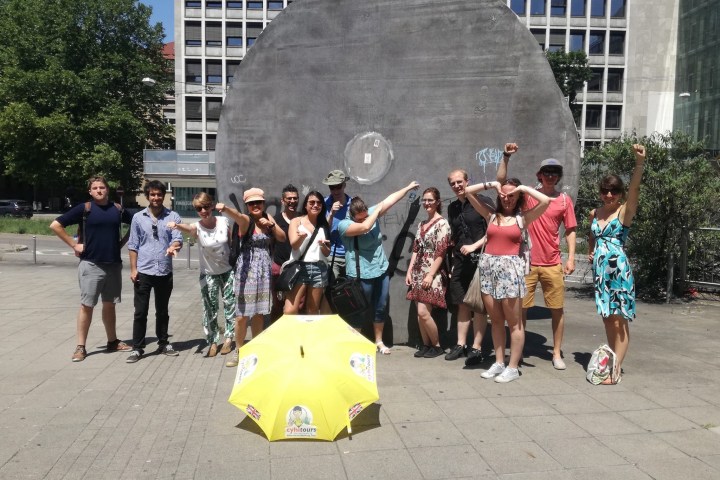 a group of people standing in front of a building