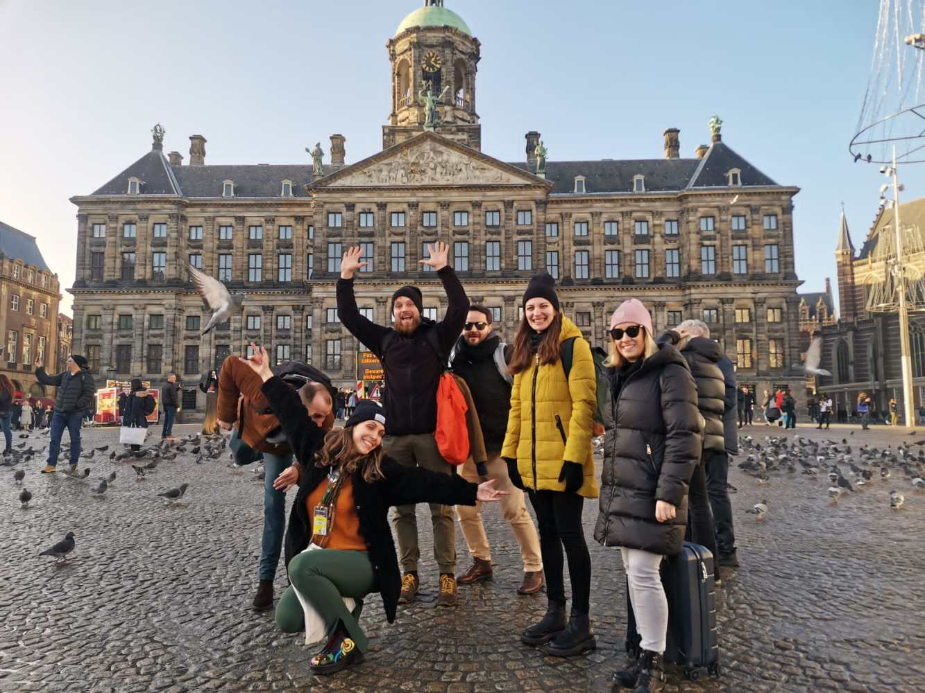 a group of people standing in front of a building