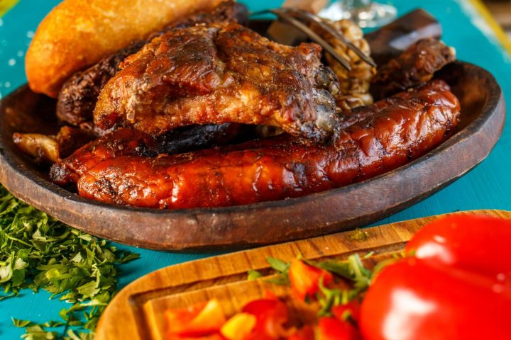 a plate of food and a glass of wine