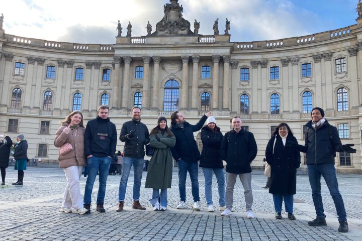 a group of people standing in front of a building