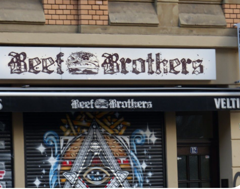 Beef Burger Cologne a sign above a store
