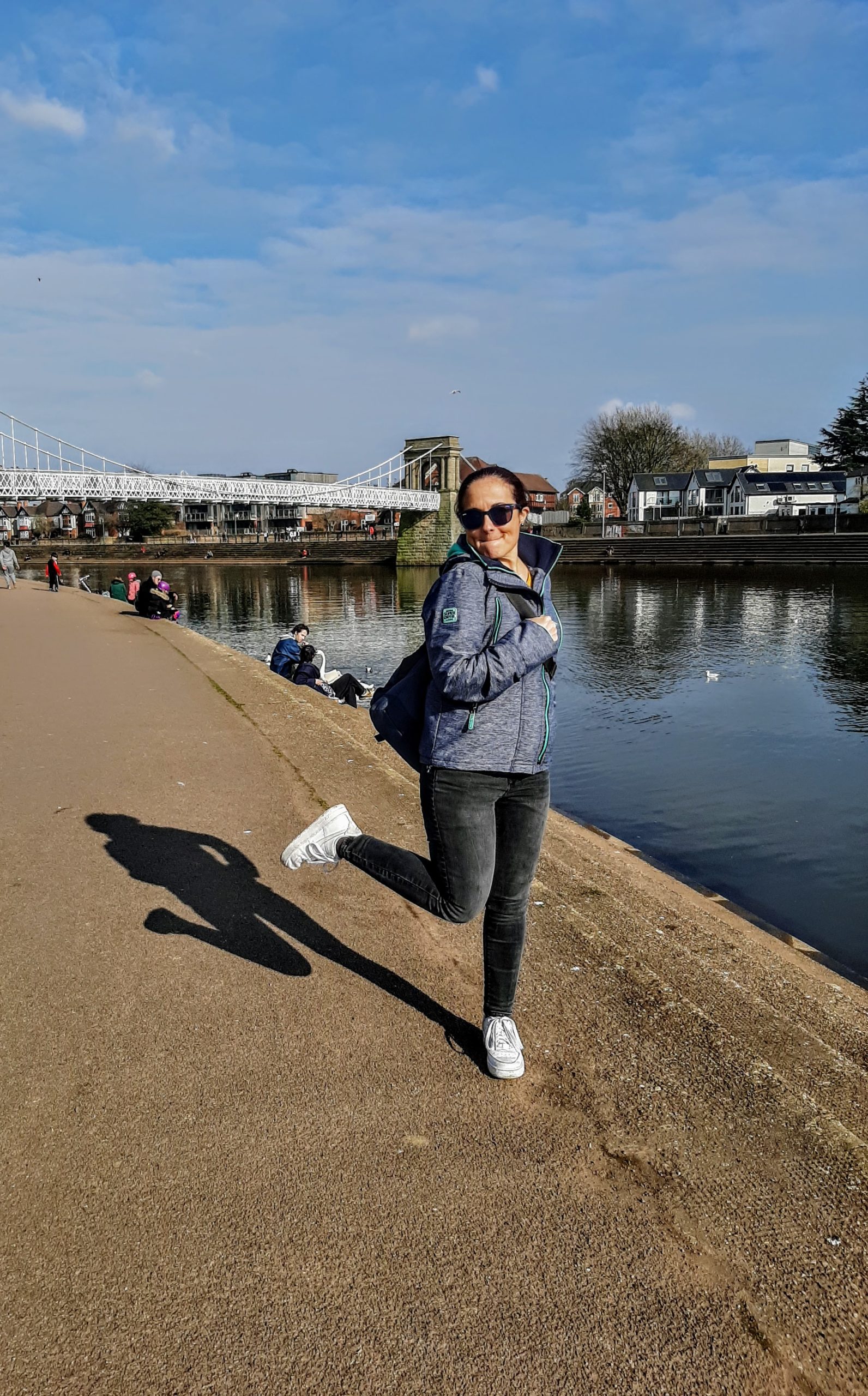 a person standing next to a body of water