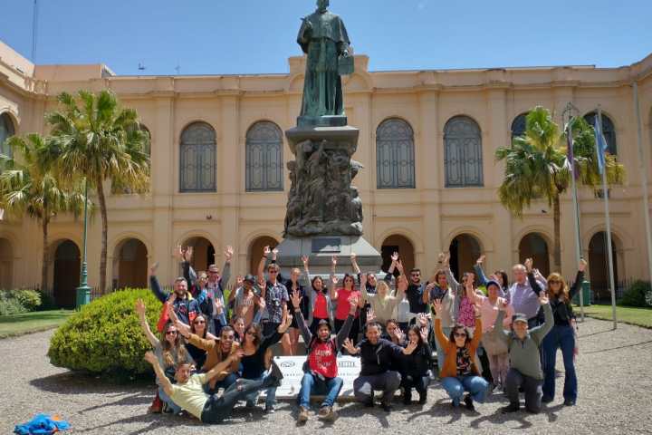 Tour takers in front of the Statue of friar Fernando Trejo at the Cordoba National University
