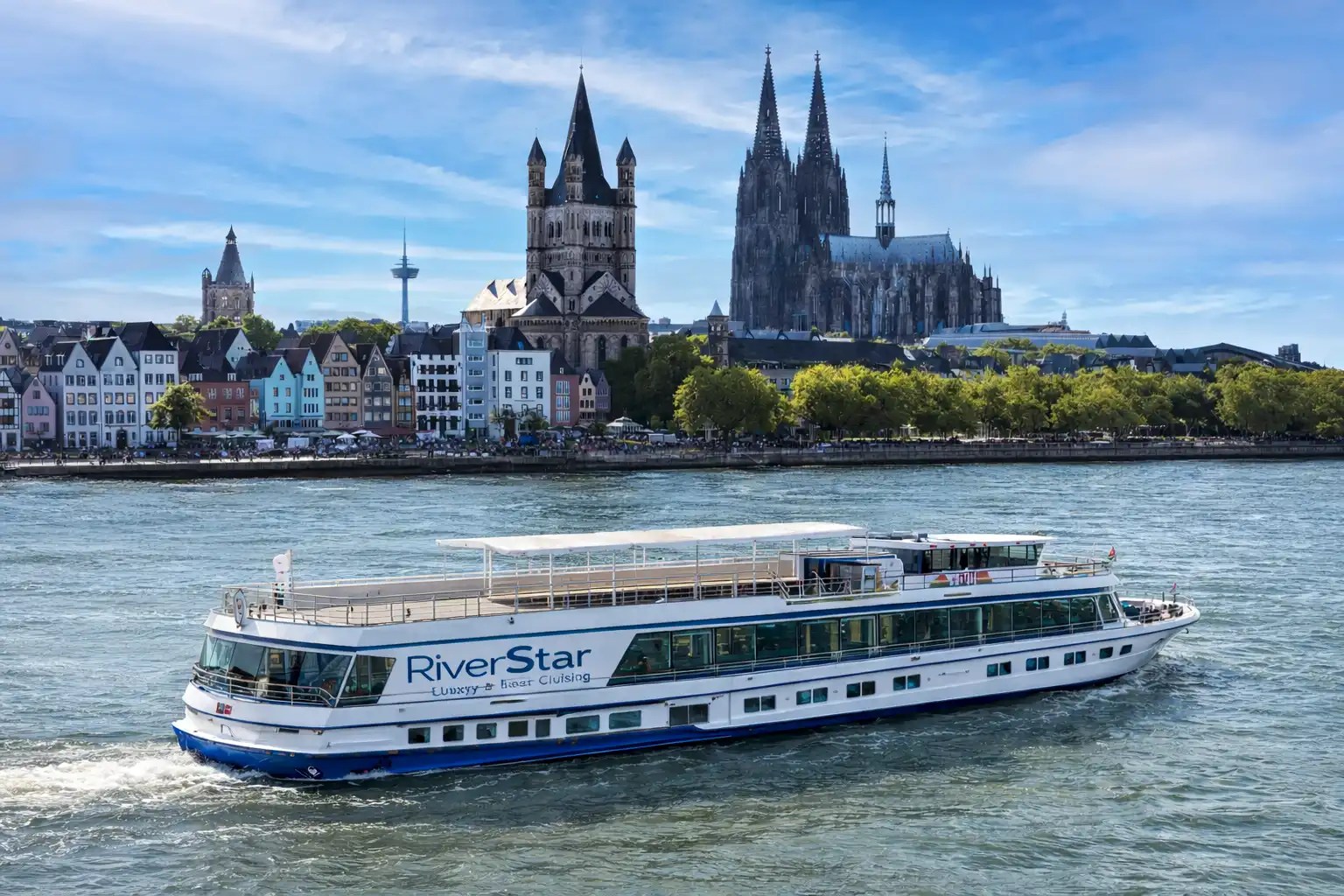 Rhine cruise boat passing Cologne skyline with cathedral on the Rhine River