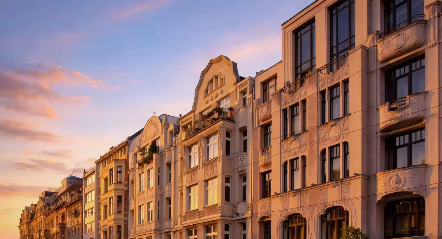 Beautiful late 19th-century Gründerzeit buildings and facades in the Belgian Quarter of Cologne during sunset.
