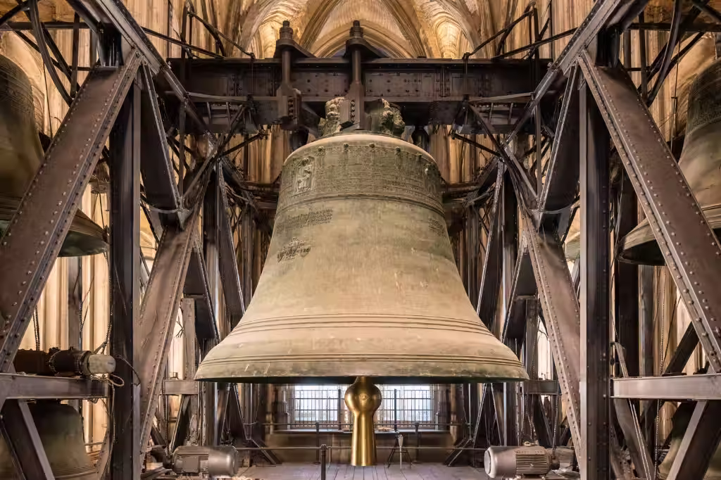 The massive St. Petersglocke bell, known as Dicker Pitter, inside the belfry of Cologne Cathedral.