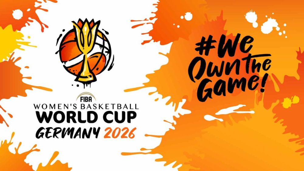 2026 Women's Basketball World Cup logo with '#We Own the Game!' slogan on orange splash background.
